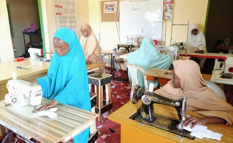 girls producing reusable sanitary pads