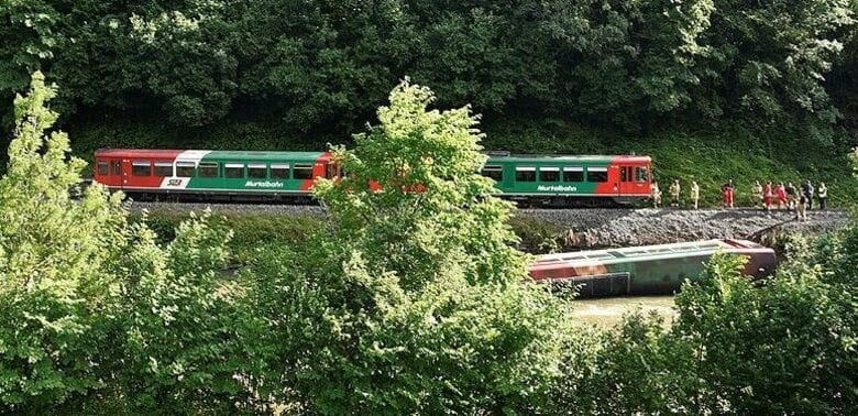 train crashes into river