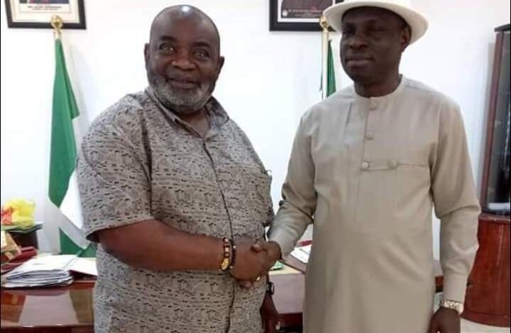 Godwin Udoedehe (left) being welcomed to the APC by Rt Hon Elder Aniekan Akpan, the State Chairman of PDP